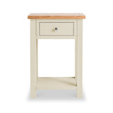 A small, cream-colored side table with a natural wood top and a single drawer, standing against a white background.