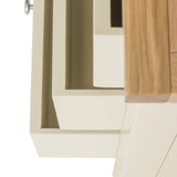 A close-up of a light-colored modern furniture piece with a partial wooden edge, possibly a ceiling attachment or shelf in an off-white room.