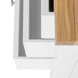 A close-up of a modern cabinet corner shows white and wooden textures, focusing on the design details and material contrast.