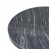 A circular black marble table top with distinctive white and gray striations, isolated against a white background.