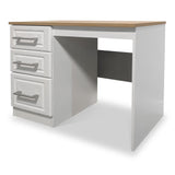 A white desk with a wooden top, featuring three drawers with metal handles on the left side, stands against a neutral background.