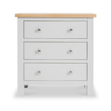 A white three-drawer chest with a natural wood top and round silver knobs on a plain background.