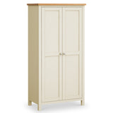 A beige wardrobe with two doors, each fitted with a round knob, stands against a plain white background, suggesting a simple interior setting.