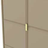 A beige double door with a golden handle on the right side, partially ajar, offering a glimpse of a similar colored wall behind it.