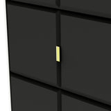 Black drawers with a minimalist design and a single golden handle, against a light background.