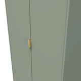 A green cabinet with a gold handle, closed, against a matching green background.