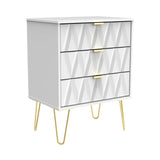 A modern grey chest of drawers with geometric patterns, gold handles, and splayed legs, standing isolated on a white background.