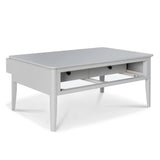 A grey coffee table with two drawers and a lower shelf stands isolated against a white background.