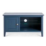 A navy blue wooden TV stand with an open shelf, a closed cabinet, and a hole for cables, isolated against a white background.