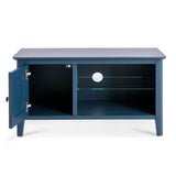 A navy blue wooden TV stand with an open shelf, a glass partition, and a cabinet door ajar, isolated against a white background.