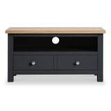 A black television stand with a wooden top features a central open shelf and flanking drawers against a white background.