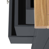 A close-up view of a black, geometric structure juxtaposed with a section of light-colored wood, potentially elements of furniture or decor, displaying sharp lines and contrasting textures.