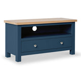 A blue wooden TV stand with a natural wood top, featuring an open shelf and two drawers with round knobs, isolated on a white background.