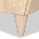 A wooden table leg protrudes diagonally downward from a woven-textured tabletop against a white background.