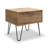 A wooden nightstand with a single drawer and thin black metal legs stands idle on a white background.