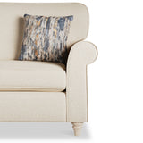 A beige armchair with a patterned cushion, against a white background.