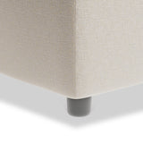 A beige fabric sofa corner with a dark round leg on a white background.