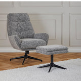 A modern armchair with matching footstool is placed on a wooden floor against a paneled wall. Both pieces have a black five-star base and are upholstered in a speckled gray fabric.