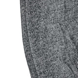 Gray textured fabric showing part of a curved surface, likely upholstered furniture, with no distinguishable activity or context.