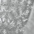 Close-up of a textured fabric with a heathered grey appearance, possibly clothing, with no discernible action or context.