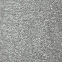 A textured gray surface occupies the frame, revealing a close-up of a rough, granular material with a tight focus that gradually softens towards the edges.