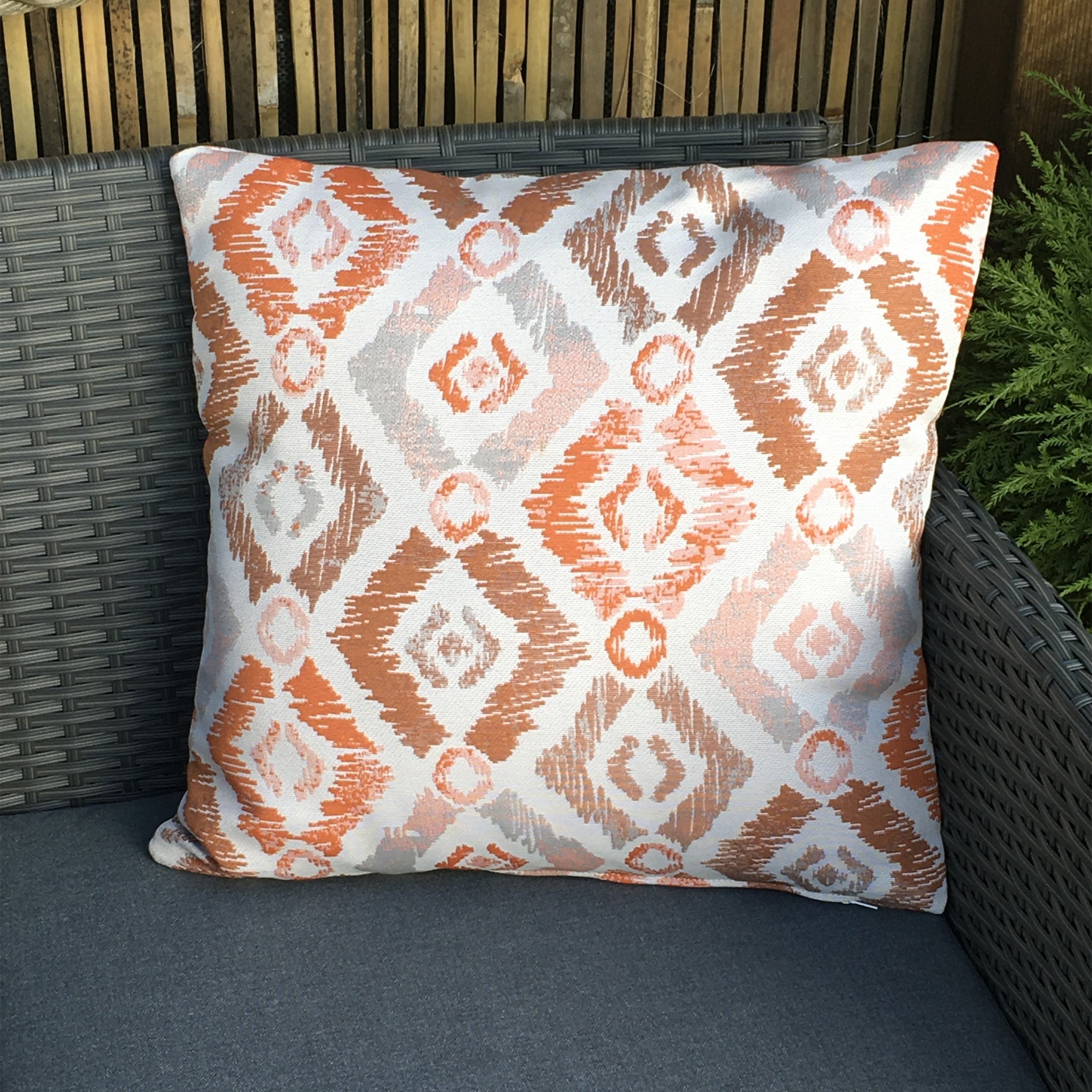 Grey and orange outlet cushion