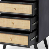 A black, open three-drawer chest with beige woven panel inlays is set against a white background.