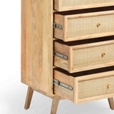 A wooden chest of drawers, partially opened to reveal the construction, with cane webbing on drawer fronts, against a white background.